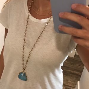 Beaded necklace with blue stone